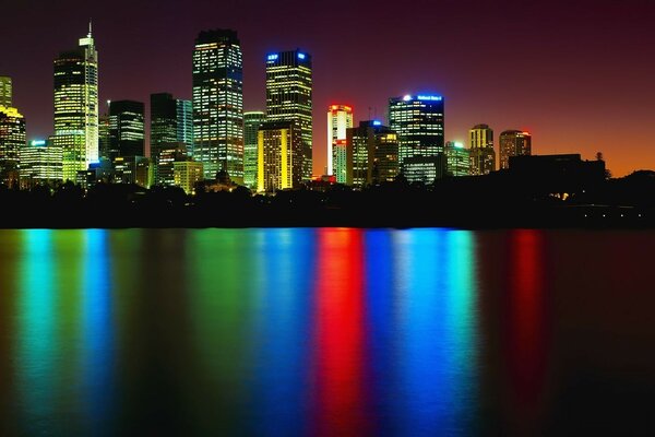 Colored reflections of city lights in the water