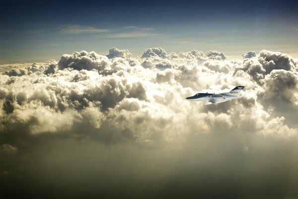 A plane flying against the background of beautiful clouds