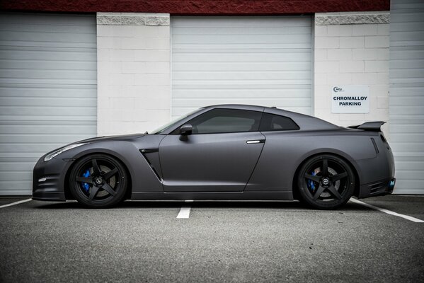 Nissan grey car with black wheels