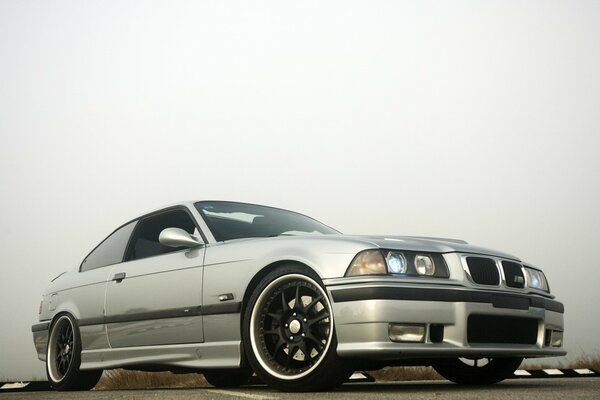 Silver bmw e36 car