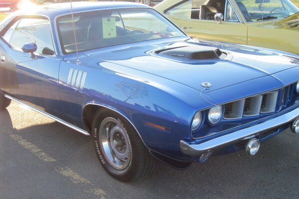 Blue car with sports tires and retro headlights