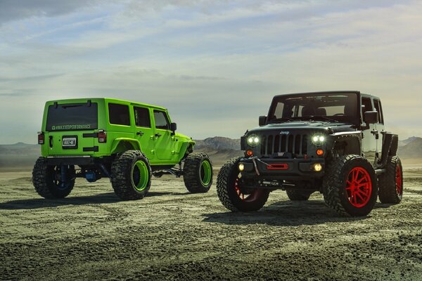 Green and black jeep with headlights on