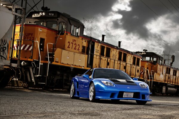 Railway train on the background of dark clouds