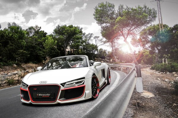 White Audi rushes along the highway