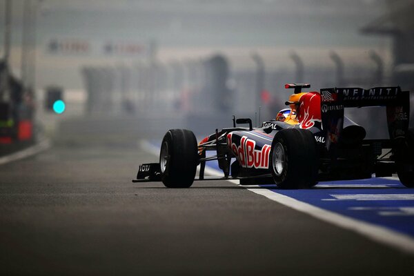 A racing car is waiting for its turn