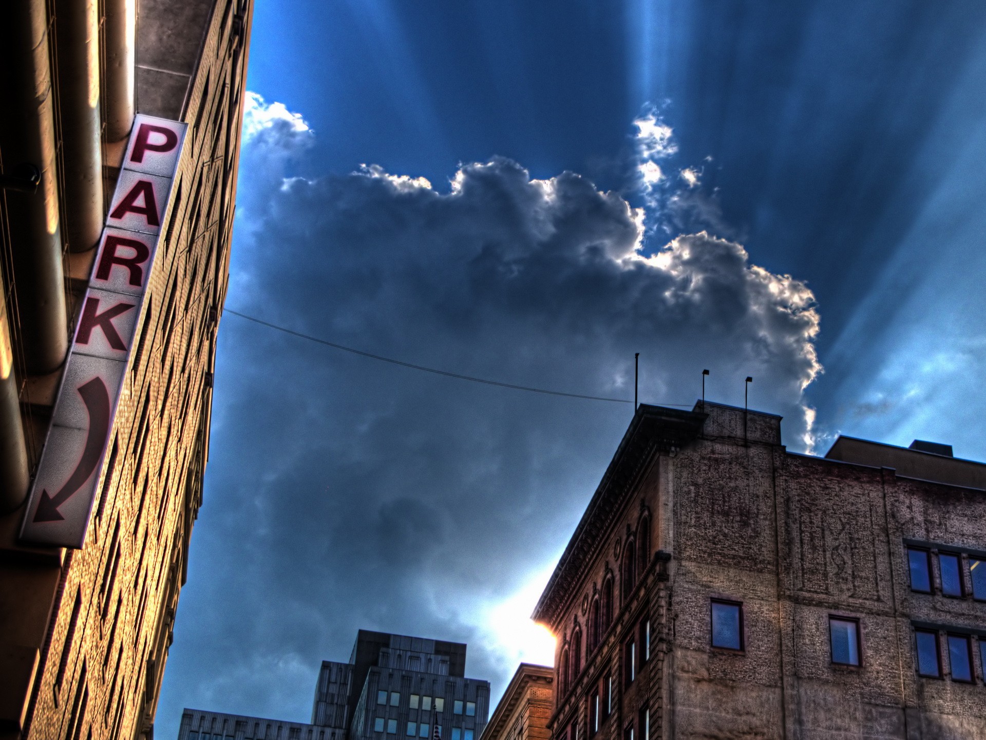 casas edificios letrero nubes luz