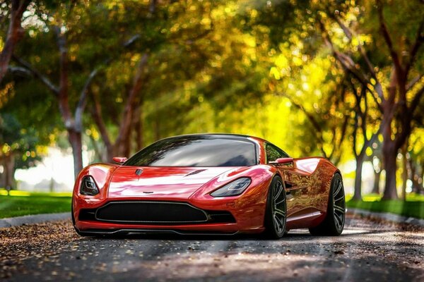 The cool aston martin looks like it s winking merrily