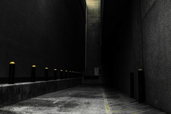 A gray wall in a night alley