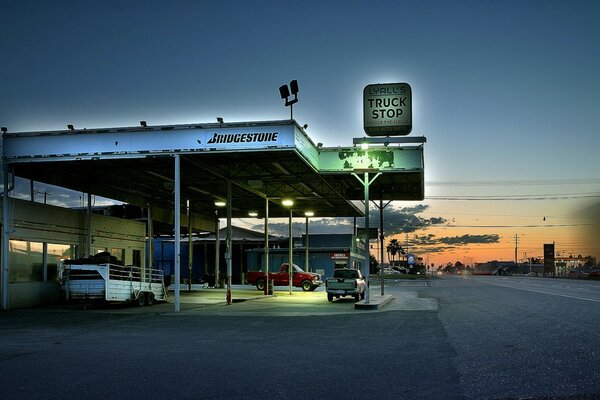 Truck parking by the road at sunset