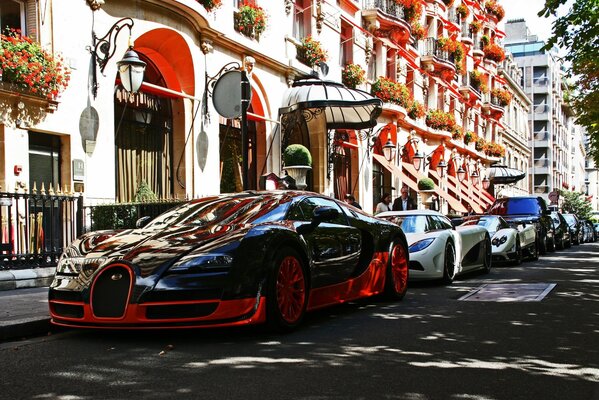 Colorful houses and cars of Qatar Airways and Sportster on the street