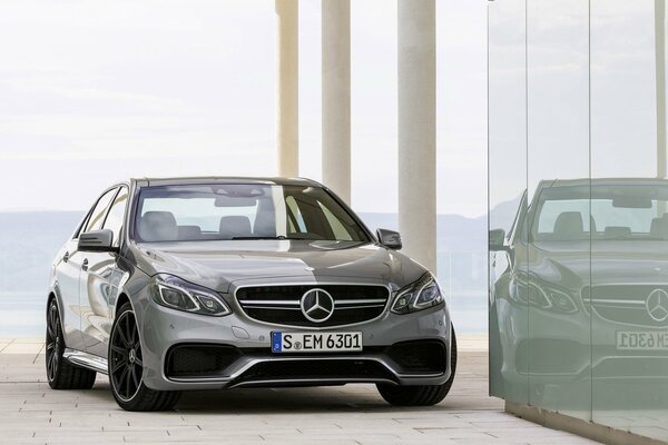 Reflection of Mercedes-Benz e 63 in the building