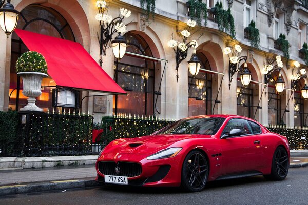 Stylish cool and expensive life the red color of the car is proof of that