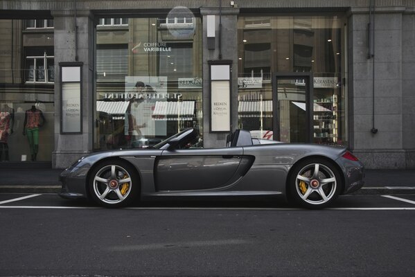 A silver Porsche complementing this city