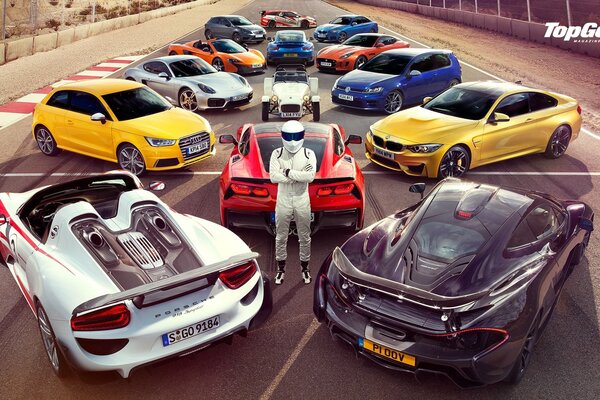 Supercars on the race track with a racer