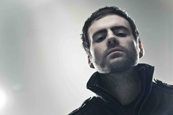 DJ Gareth Emery looks down