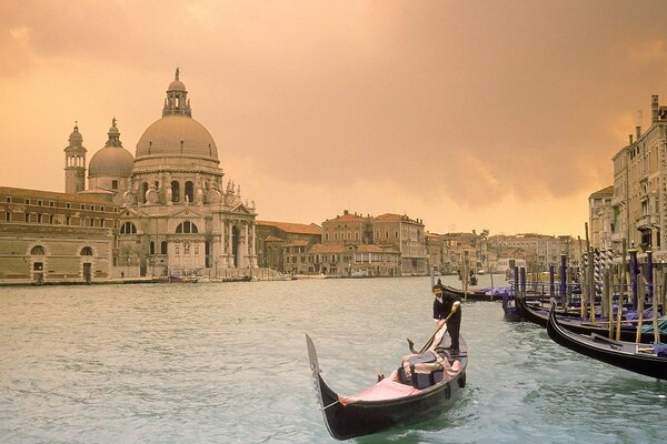 Italy. Venice. River channel. Gondolier