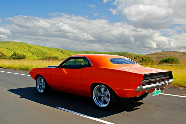 A beautiful car on a good road in the open spaces of nature