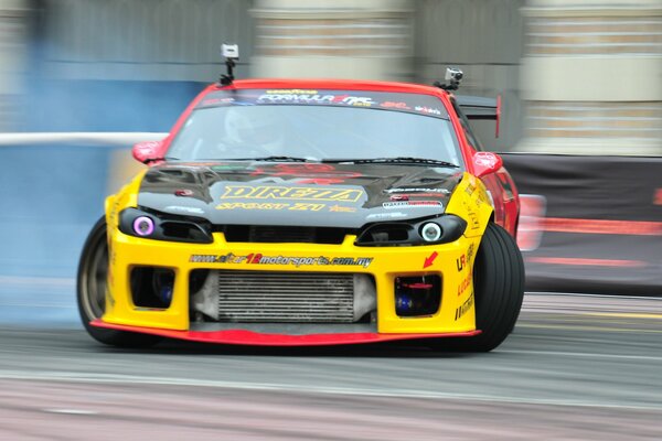 Red and yellow car at the races