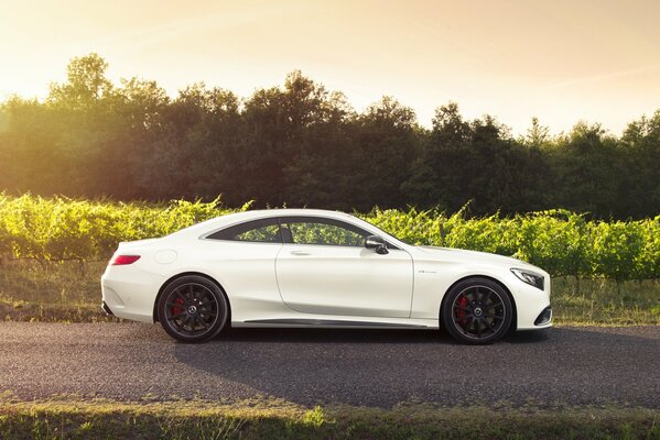 White mersedes benz s63, snow-white mersedes benz, mersedes benz coupe on the road, snow-white mersedes benz car on the road outside the city