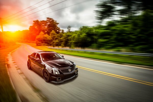 Black cadillac cts-v on the highway