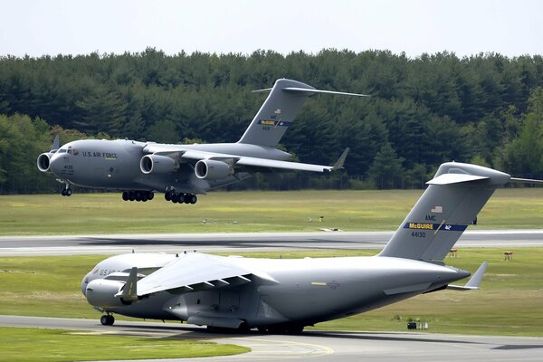 Azhenia air base, takeoff, c-17 the second plane is landing