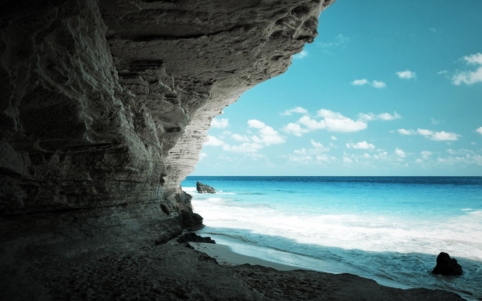 oceano costa sabbia rocce rocce orizzonte cielo nuvole mare surf vista grotta