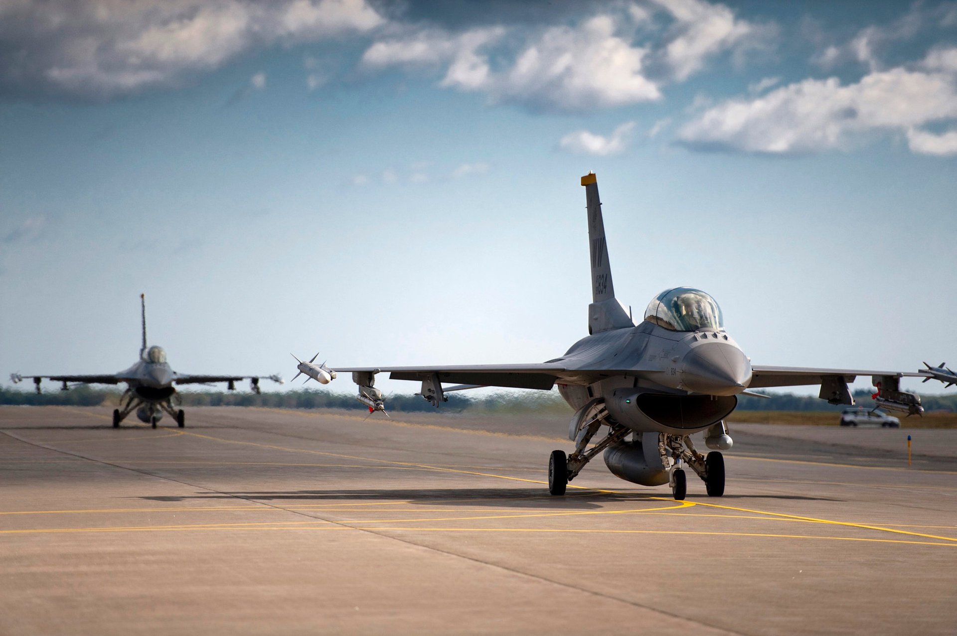 the airfield falcon multipurpose f-16 strip fighting air aircraft the sky clouds military aircraft military equipment aviation