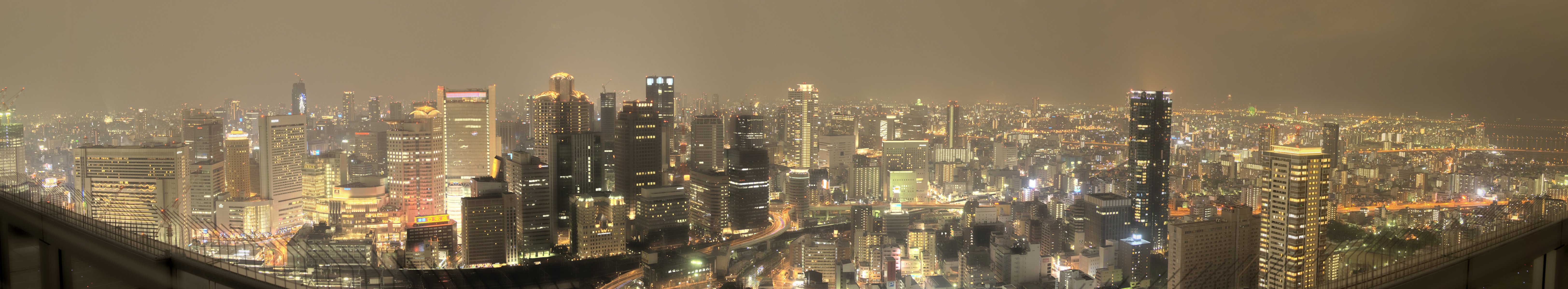 osaka japan japan panorama city osaka road night lights metropolis skyscrapers gray sky buildings view light in windows architecture