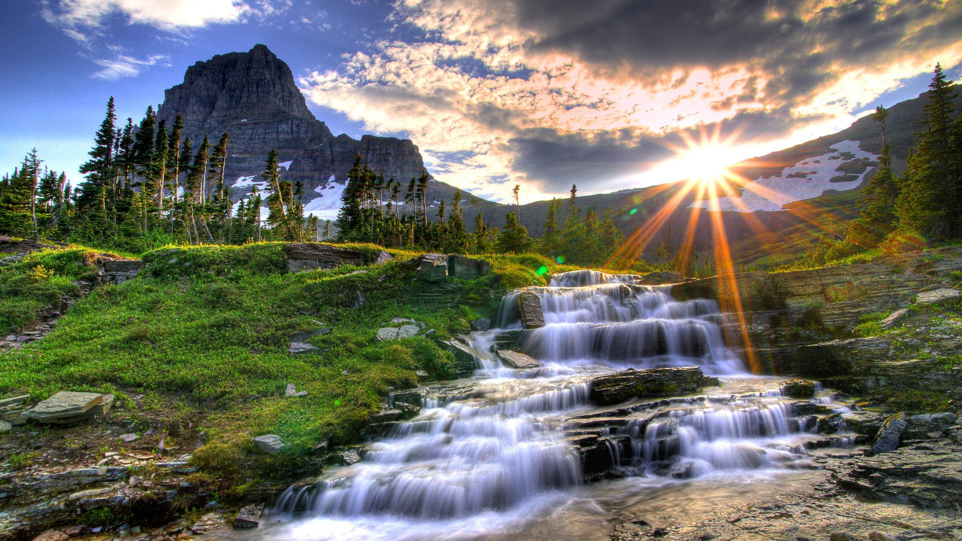 nature waterfall rocks mountains landscape the sun rays grass greens for clouds trees streams sunset