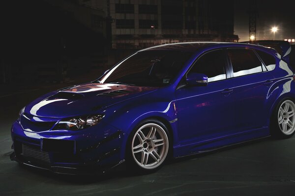 Blue Subaru Impreza in the dark