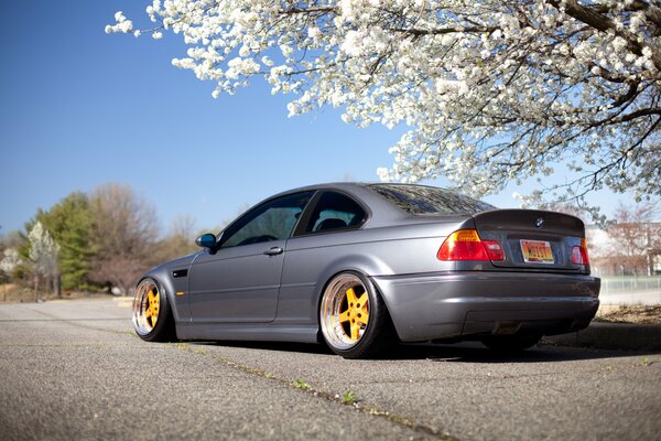 Grey BMW driving on the road in Japan