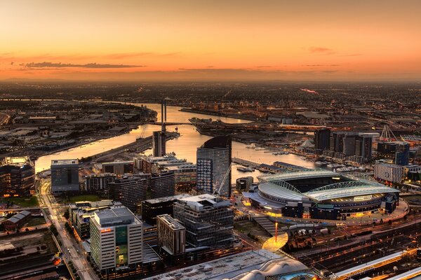 Port city on the background of sunset