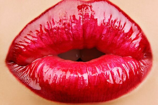 Lips painted with red lipstick