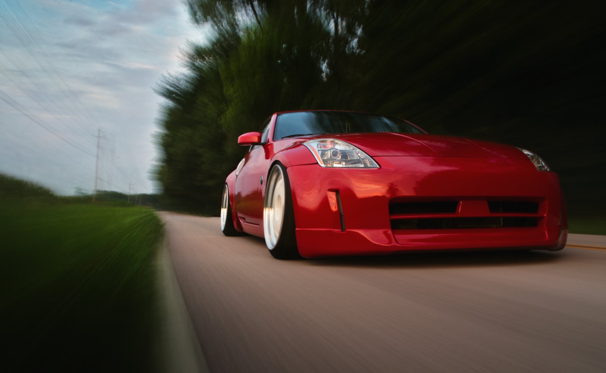 nissan 350z rojo posición nissan rojo delante en movimiento