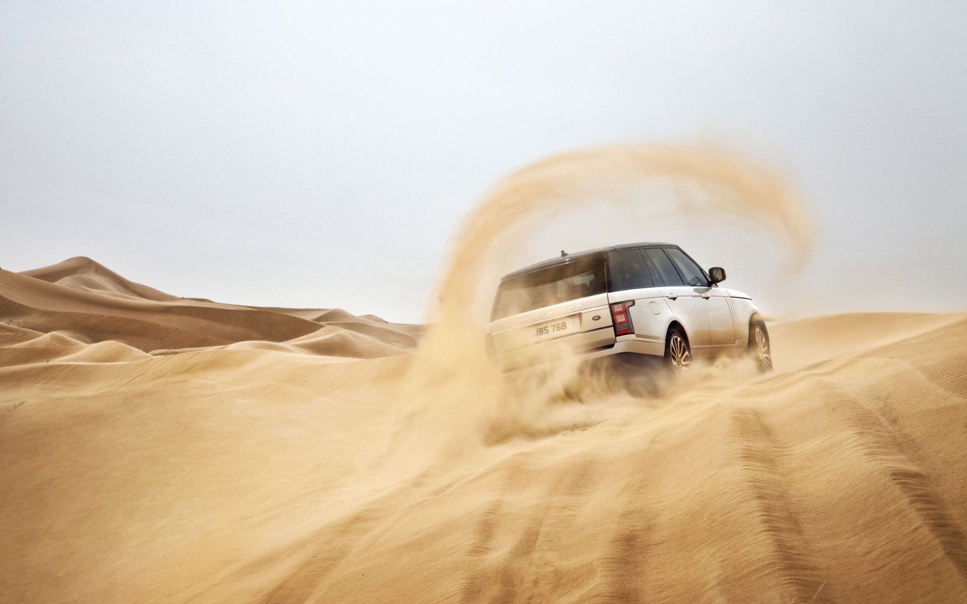 land rover range rover land rover renge rover vista posteriore sabbia