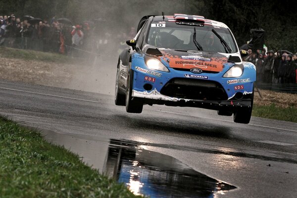 Ford flies over a wet road