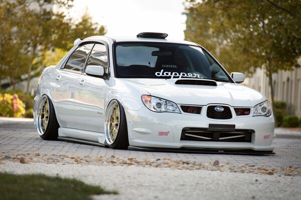 White Subaru Impreza WRX car in the park