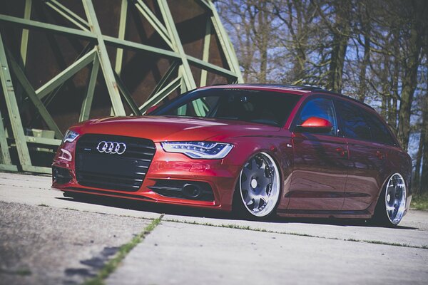 Red sports Audi next to the dome building