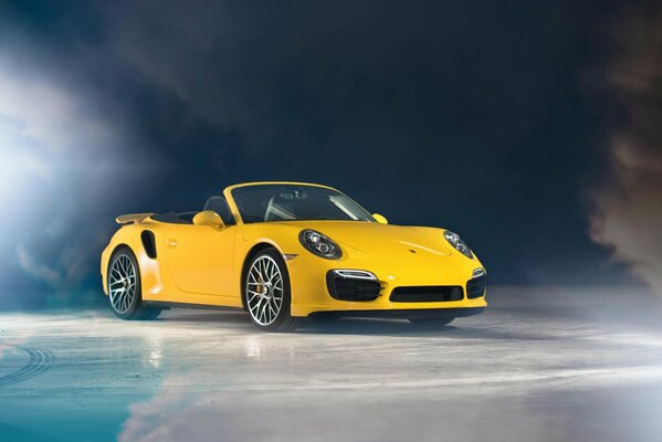 Yellow Porsche convertible in the haze