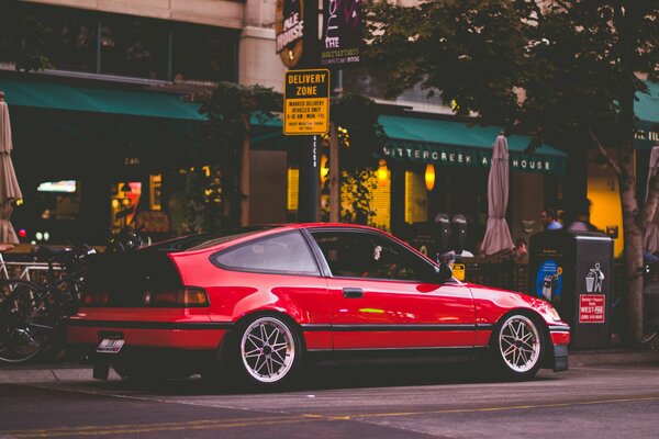 Honda cr-x, star wheels, cafe background, folding umbrella, sign in English