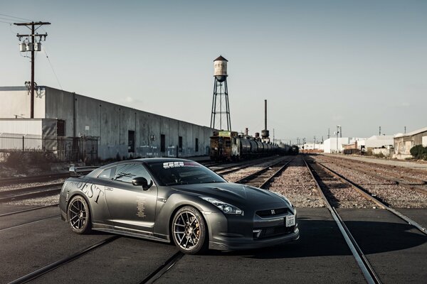 A chic Nissan in the middle of the railway