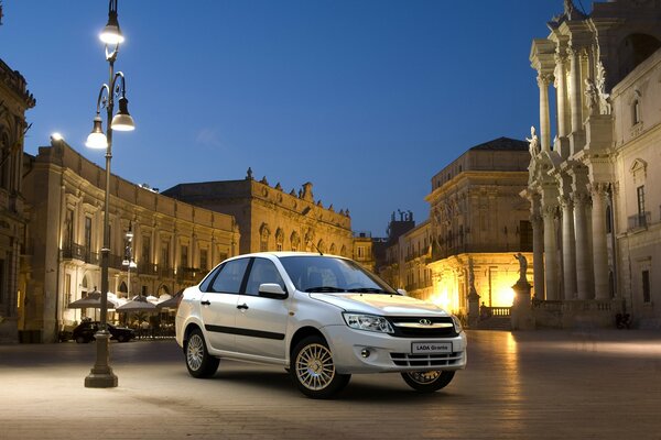 Grant s white Lada on the city square under a streetlight