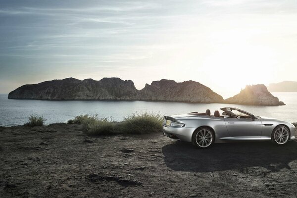 Aston martin sports car on the background of the sea