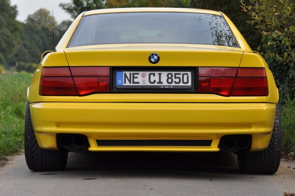 Yellow BMW SPORTS CAR rear view