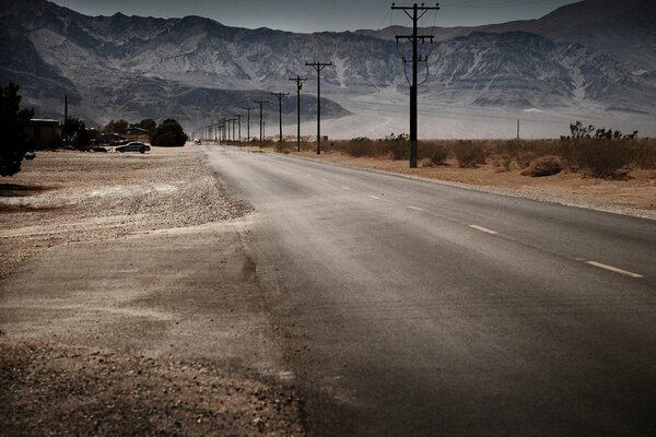 A deserted road going into the mountains