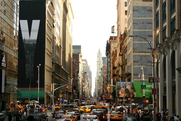 Streets of New York with taxis and skyscrapers