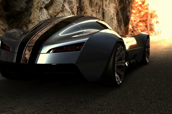 An ultra-modern sports car with an unusual mirror design rides against the background of rocks