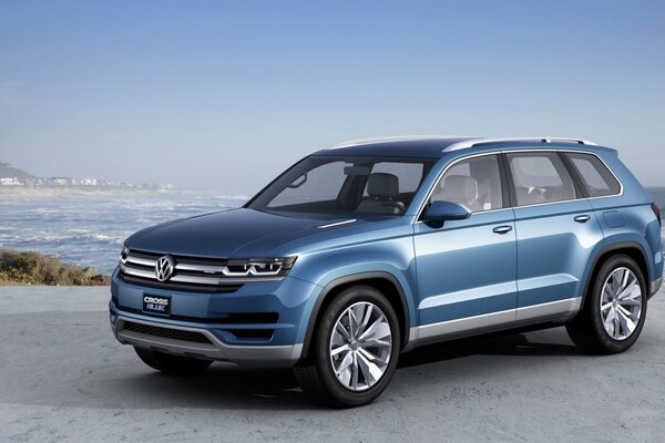 Blue VOLKSWAGEN SUV in the middle of the ocean