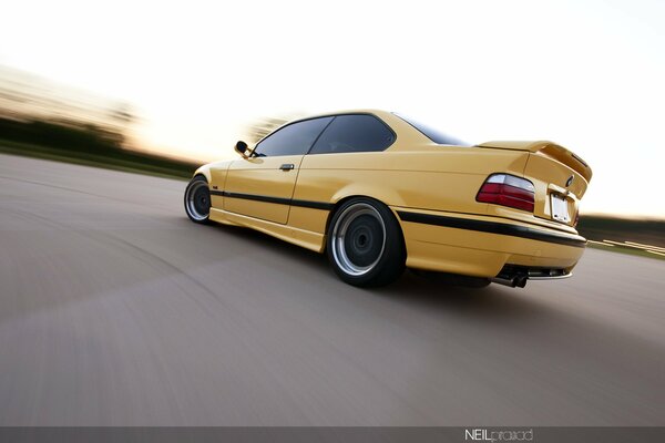 Yellow racing car in motion