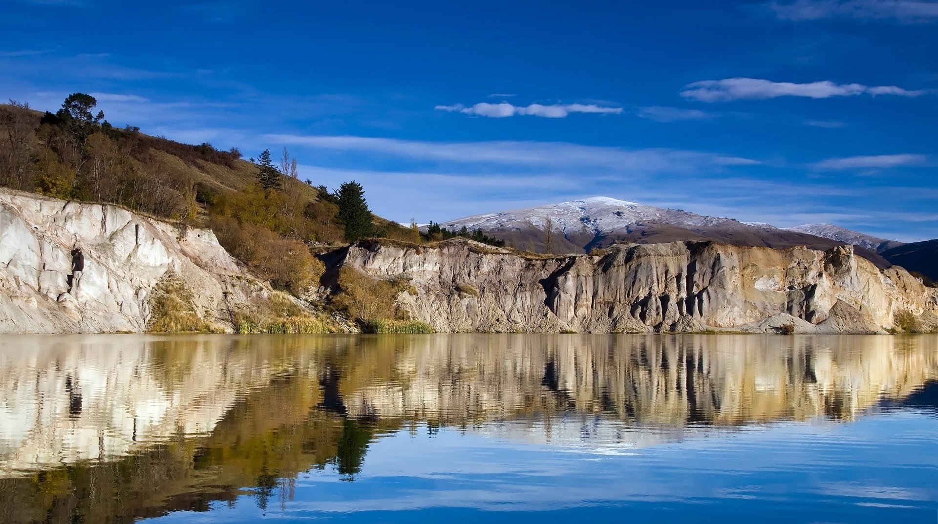 cliff river mirror image sky water clouds shore autumn landscape relief landscape